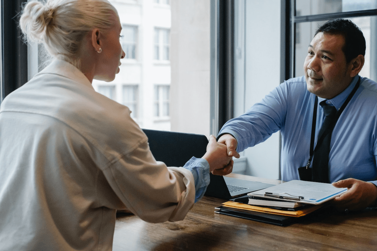 https://www.pexels.com/photo/ethnic-businessman-shaking-hand-of-applicant-in-office-5668859/