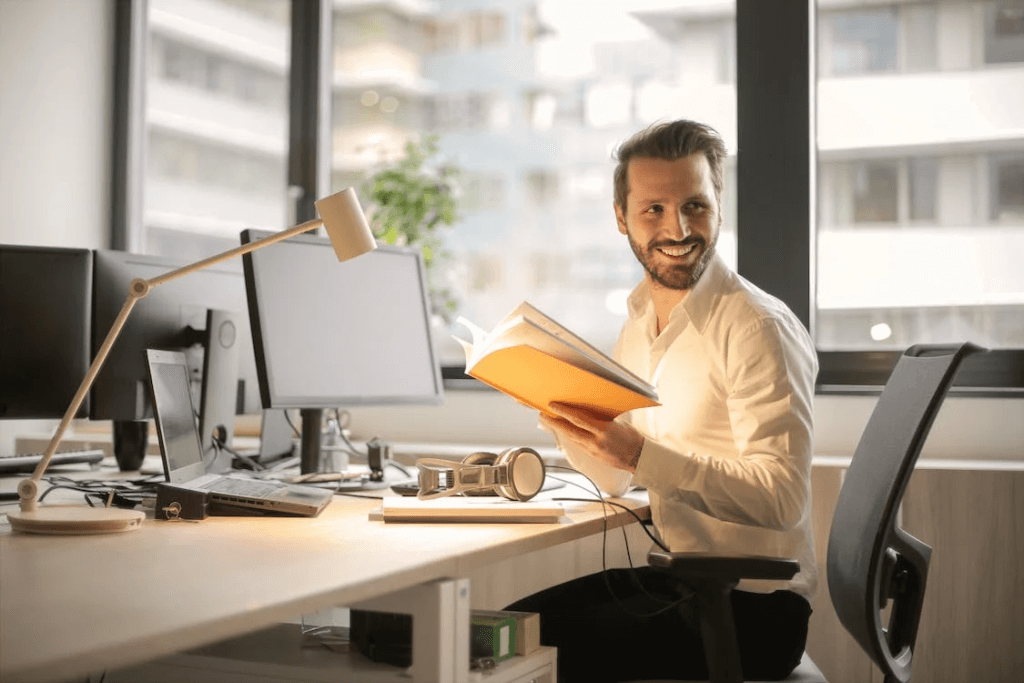 https://www.pexels.com/photo/photo-of-man-holding-a-book-927022/