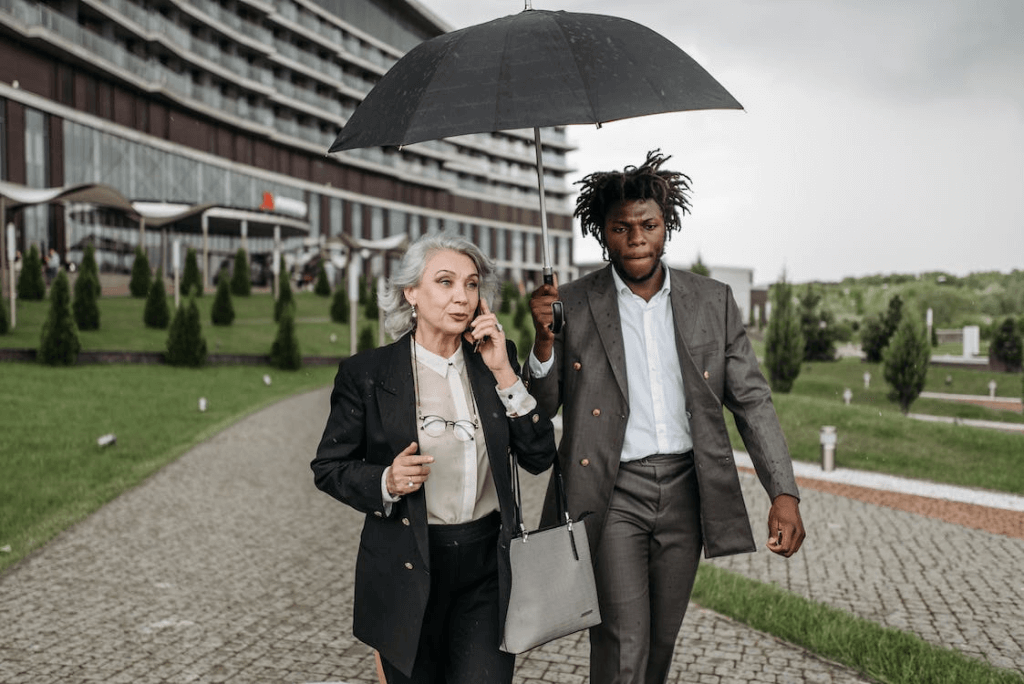 https://www.pexels.com/photo/man-holding-an-umbrella-for-a-woman-8425367/