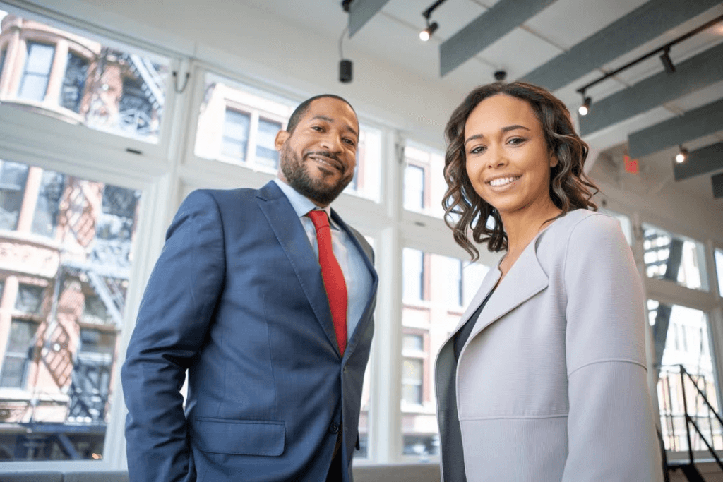 https://www.pexels.com/photo/man-and-woman-smiling-inside-building-1367269/