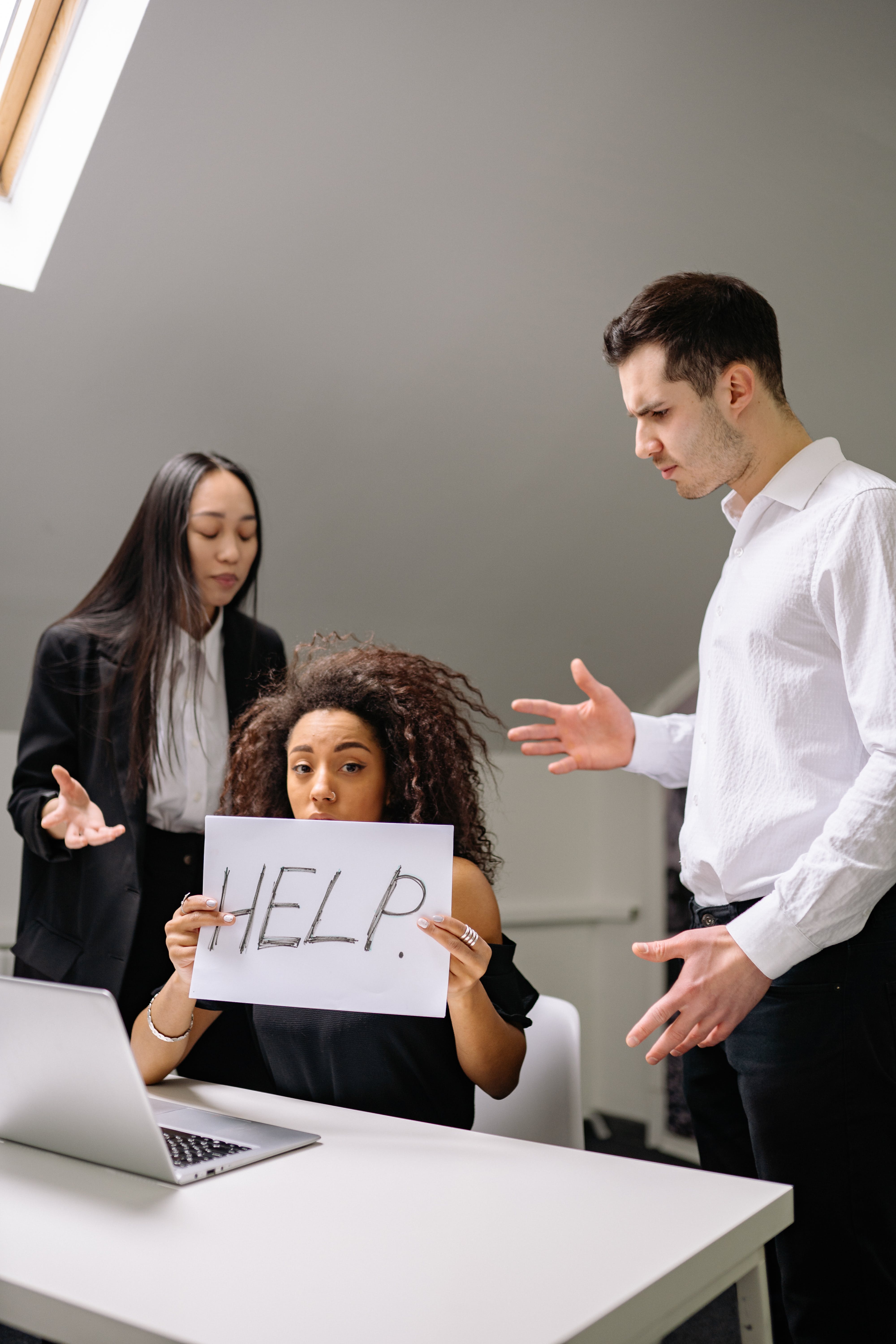 Free Woman in Black Shirt Holding White Paper with Text Stock Photo