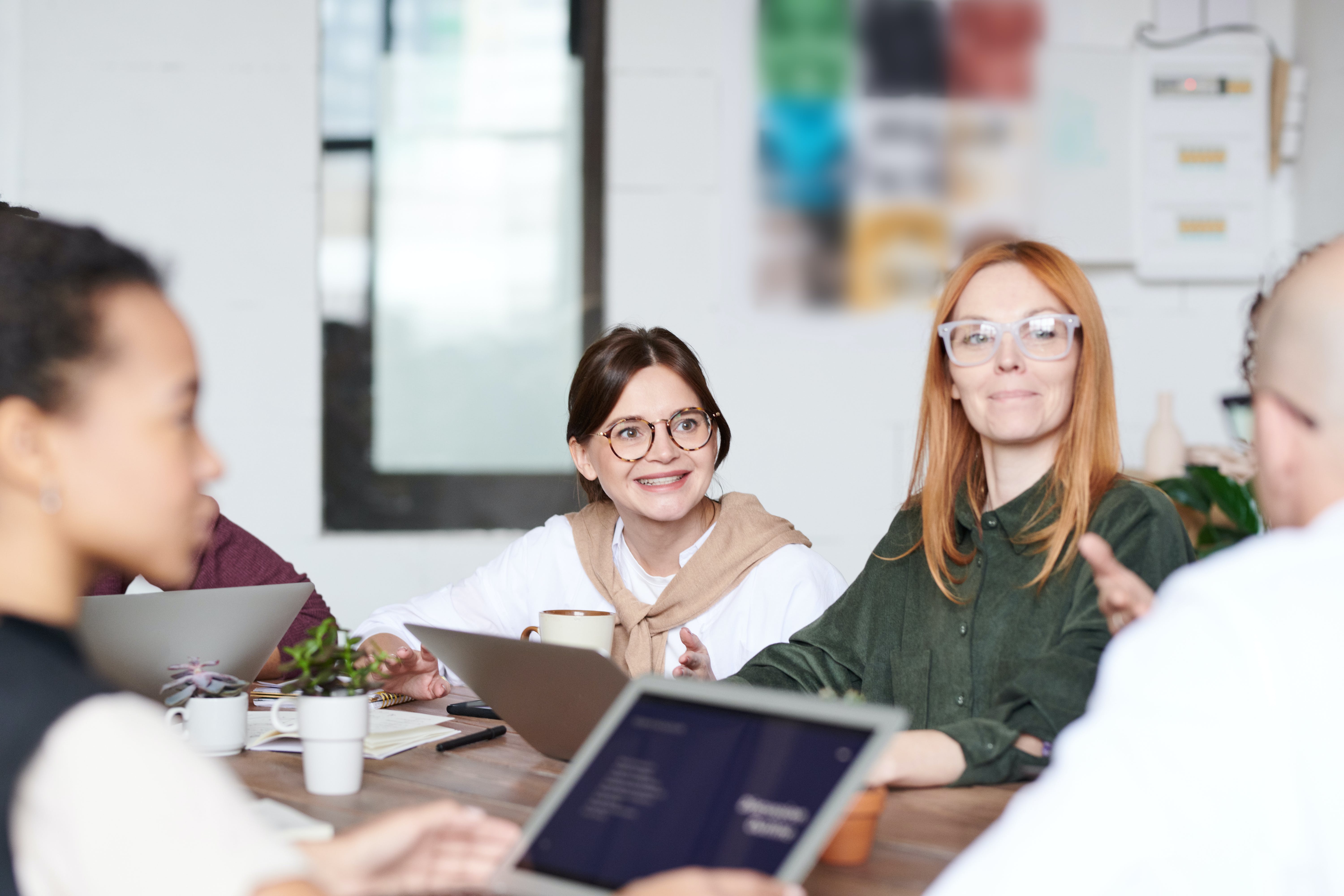 Free Group of People Sitting Indoors Stock Photo